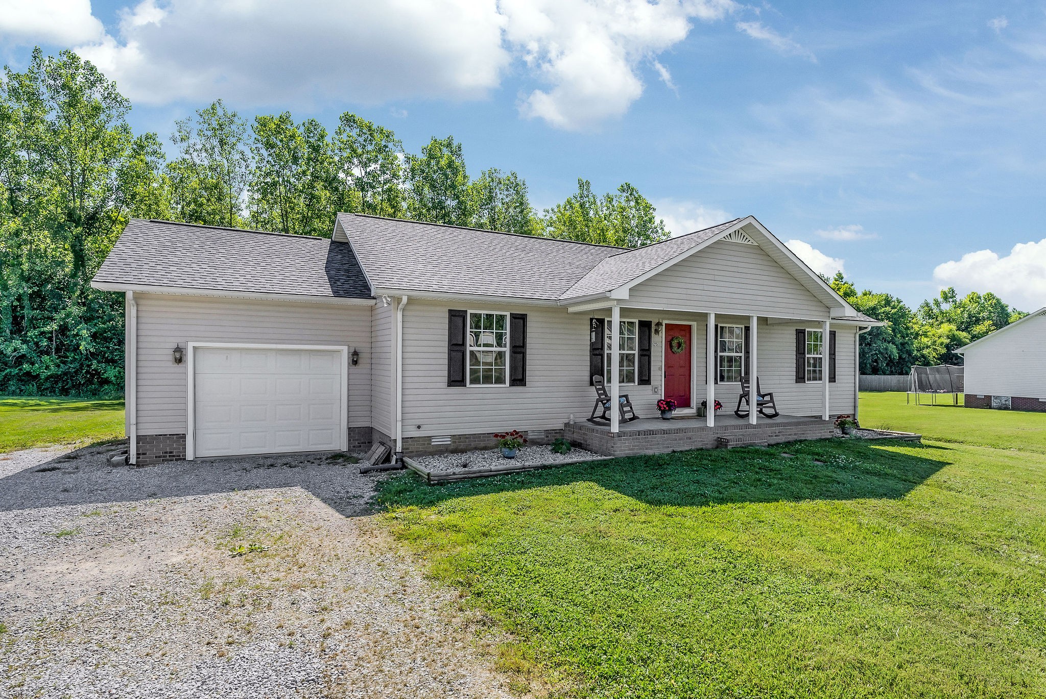 6215 Cheyenne Trail Baxter, TN 38544 - Photo 4 of 27 a front view of a house with a yard and trees