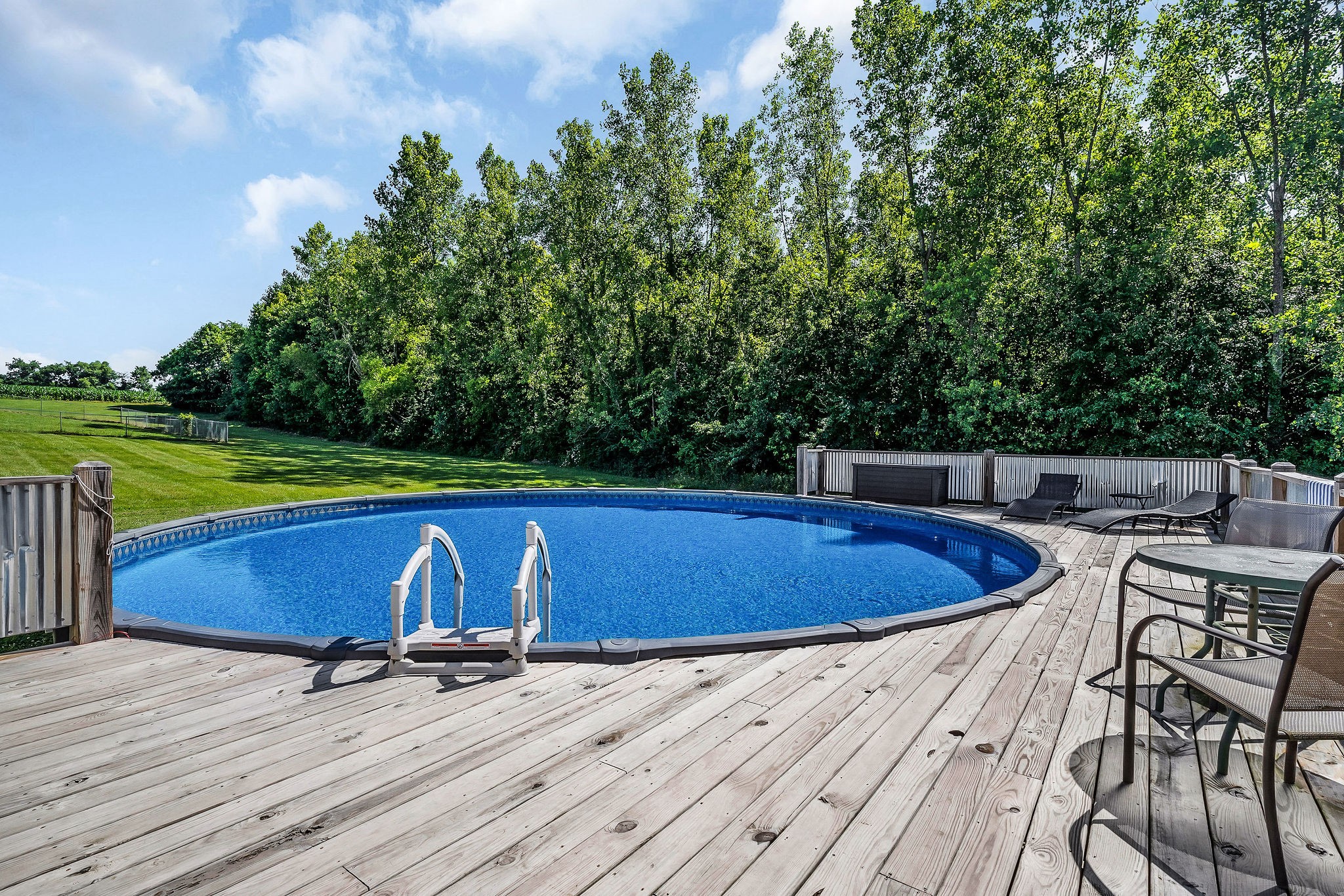 6215 Cheyenne Trail Baxter, TN 38544 - Photo 5 of 27 a view of a swimming pool with a yard and sitting area
