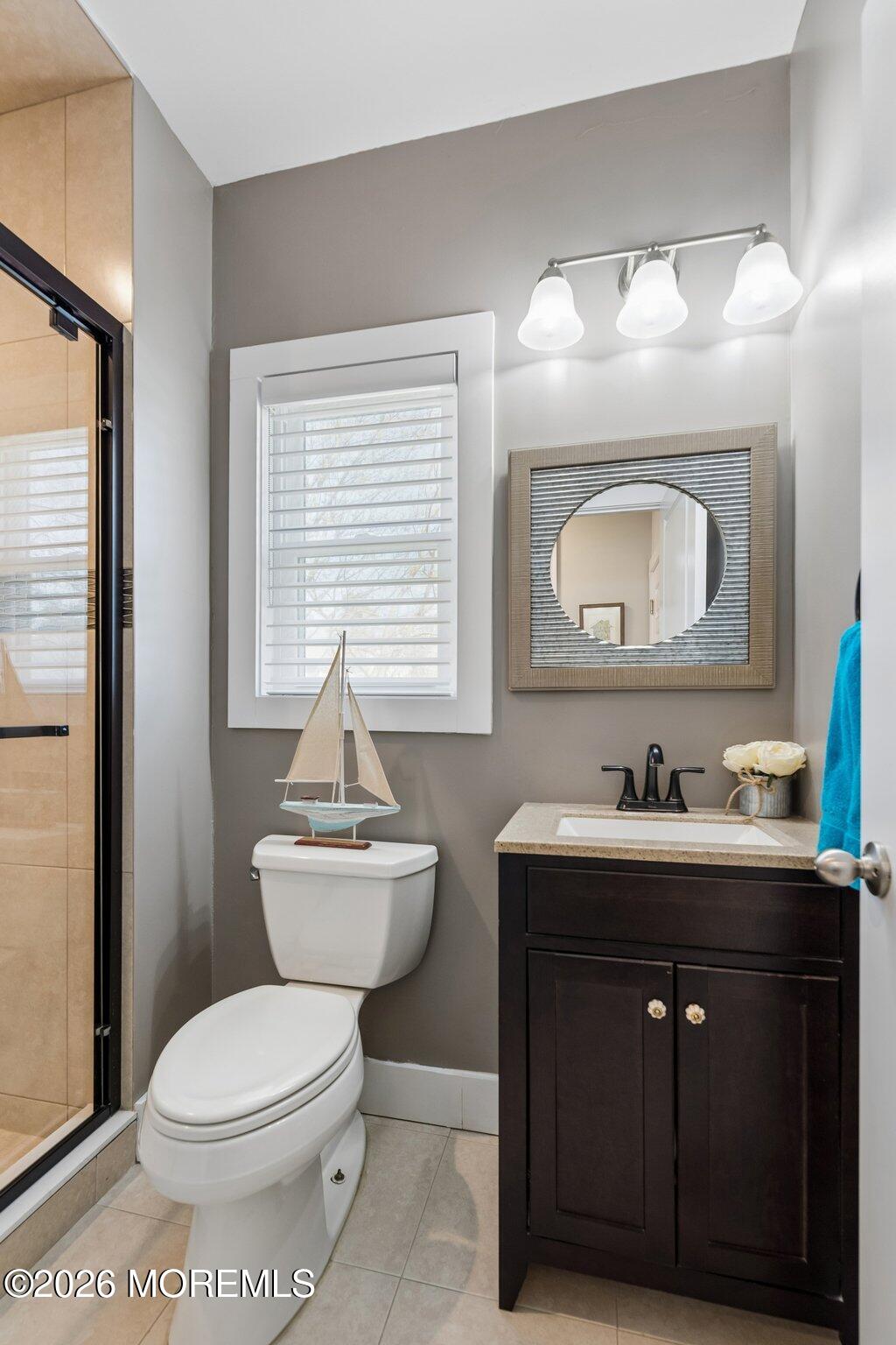149 Berkeley Drive Brick, NJ 08724 - Photo 14 of 35 a bathroom with a toilet a sink and mirror