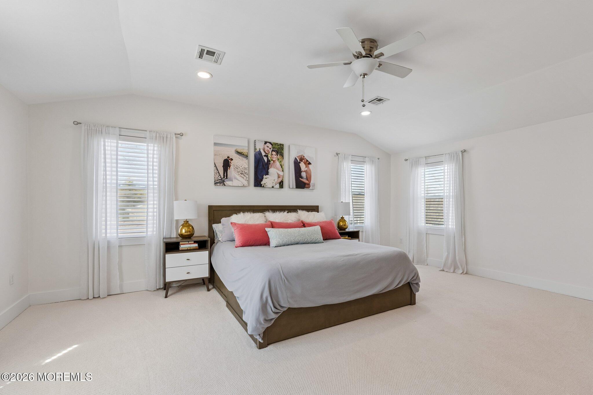 149 Berkeley Drive Brick, NJ 08724 - Photo 16 of 35 a bedroom with a bed and a ceiling fan