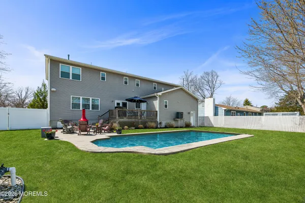 a front view of house with yard and outdoor seating