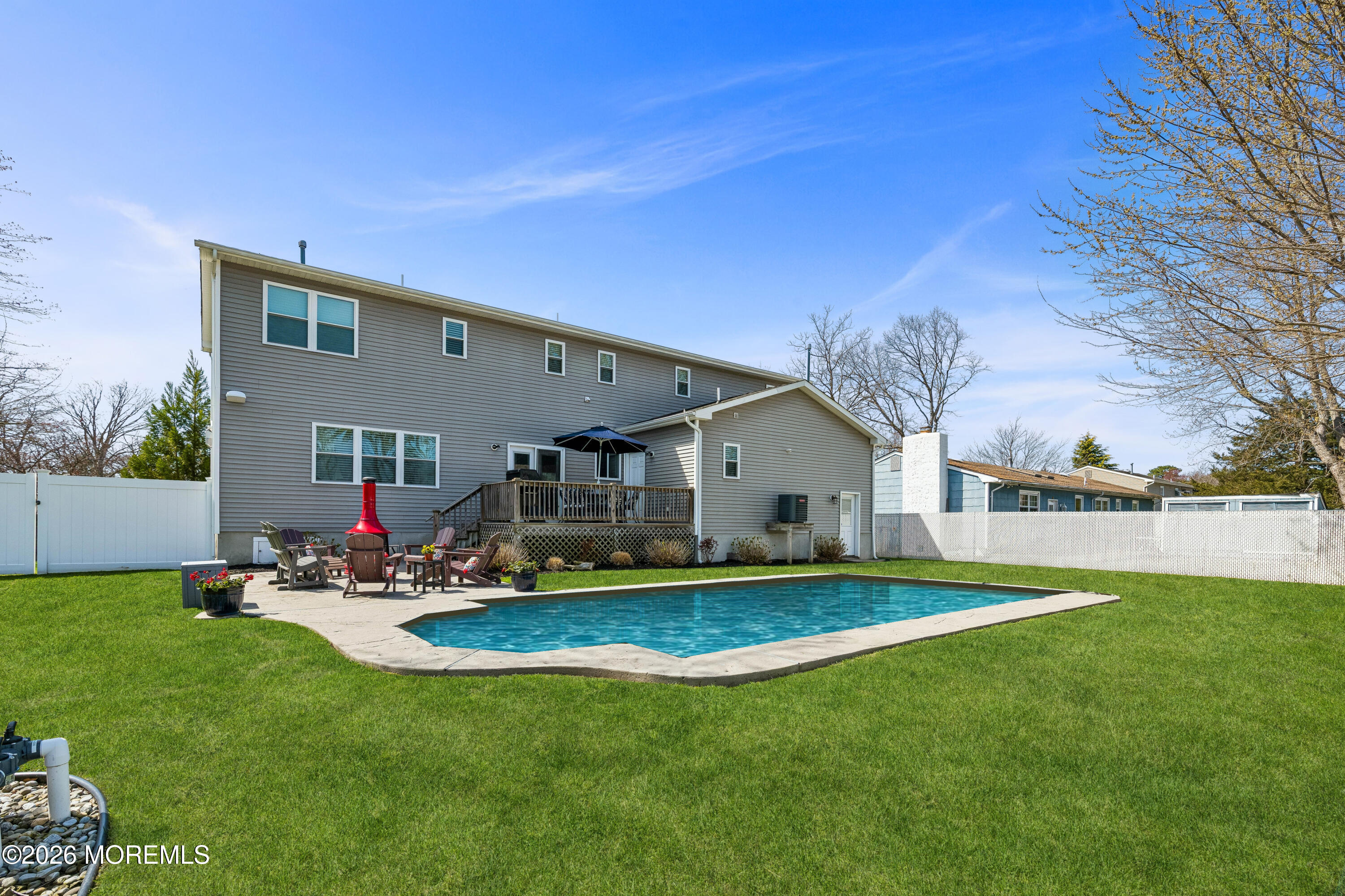 149 Berkeley Drive Brick, NJ 08724 - Photo 5 of 35 a front view of house with yard and outdoor seating