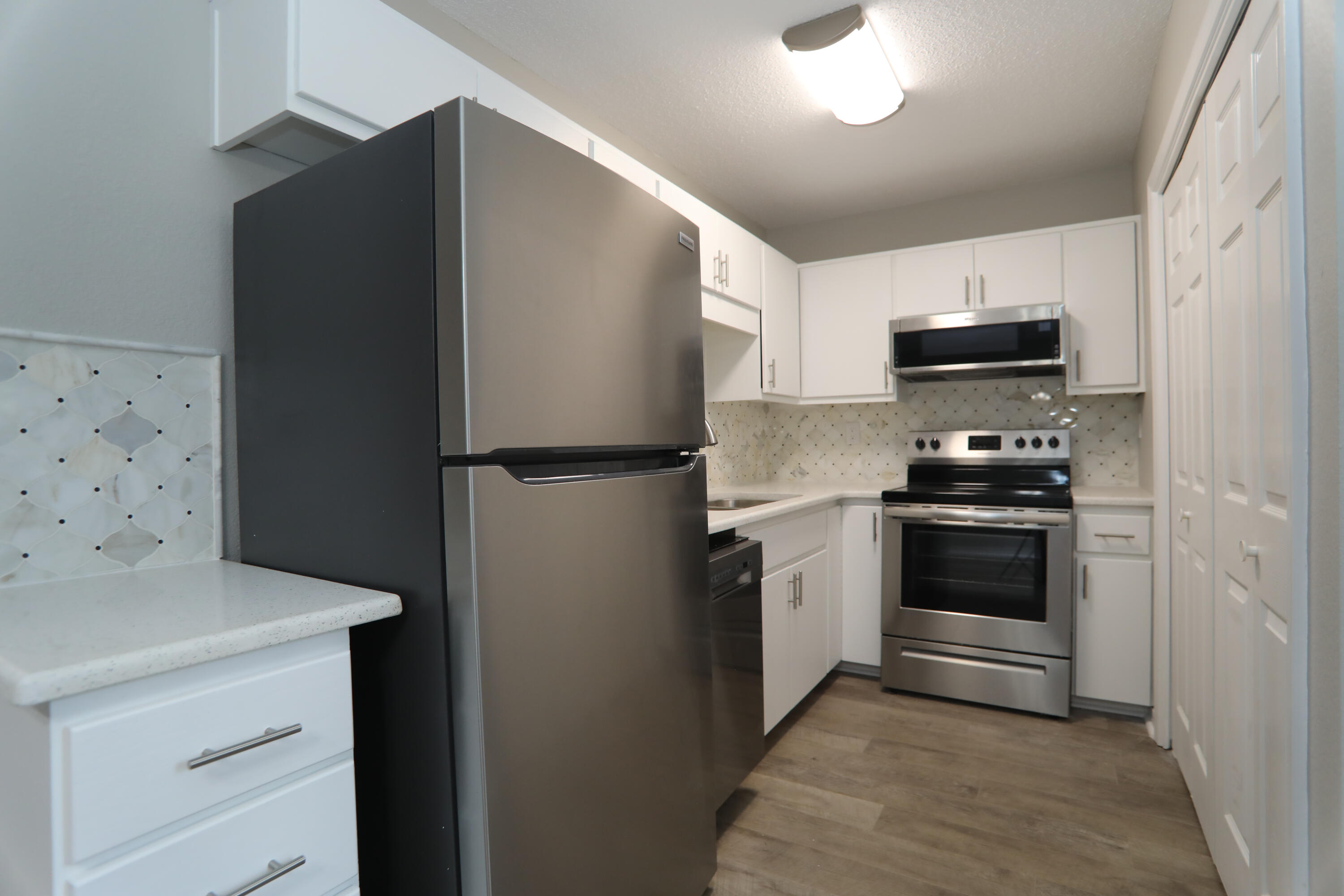 159 Patch Avenue Crestview, FL 32539 - Photo 2 of 11 a kitchen with a refrigerator and a stove