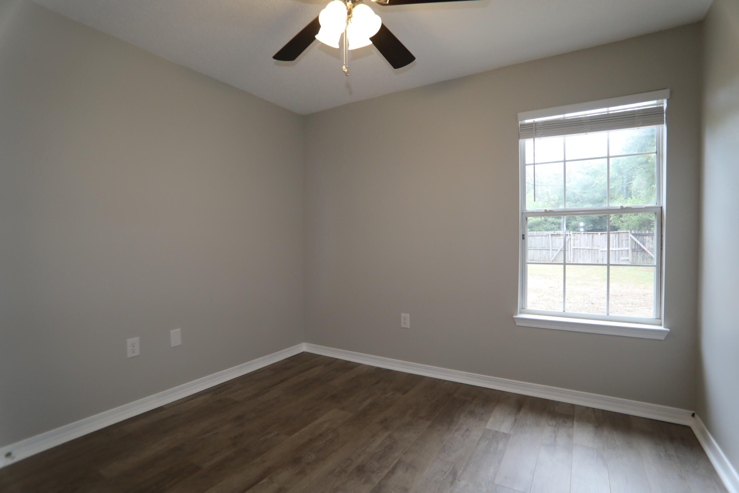 159 Patch Avenue Crestview, FL 32539 - Photo 4 of 11 an empty room with a window