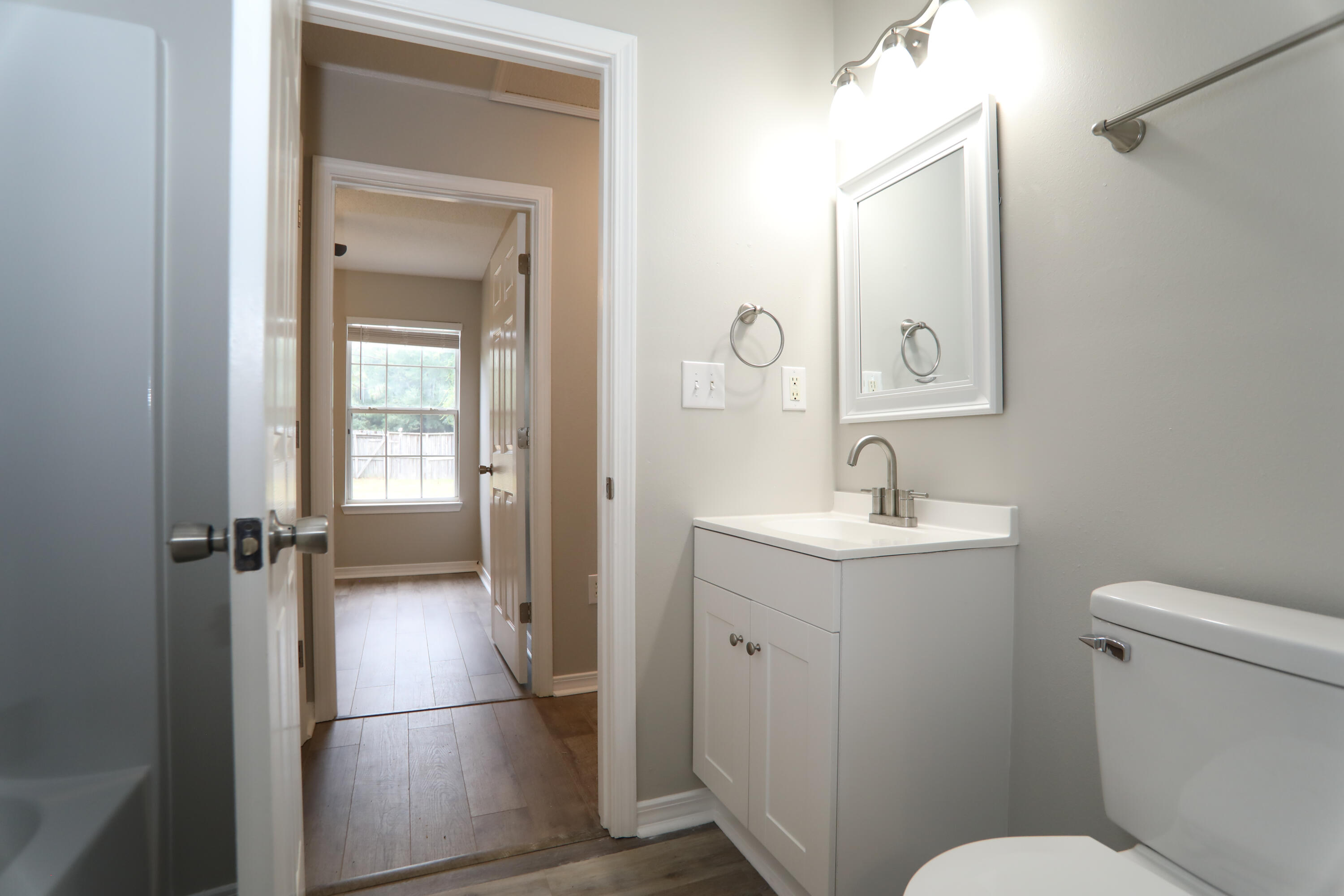 159 Patch Avenue Crestview, FL 32539 - Photo 6 of 11 a bathroom with a sink toilet and shower