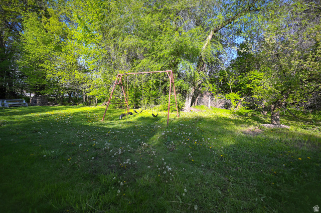 178 West 300 South Logan, UT 84321 - Photo 34 of 41 View of grassy yard featuring a playground