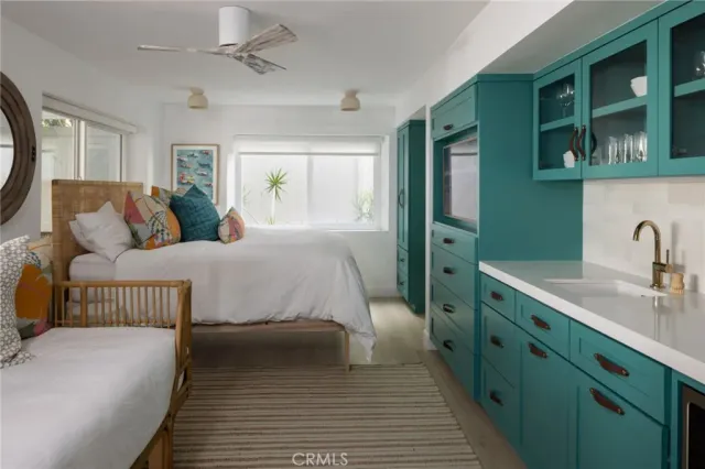 a bedroom with a bed and a dresser