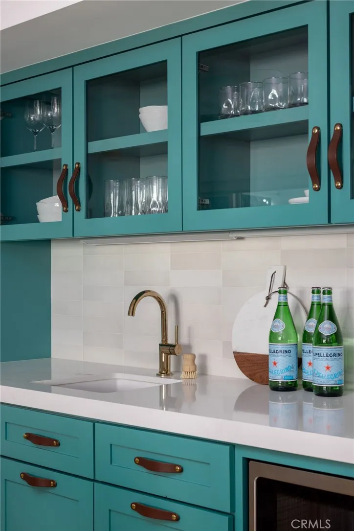 267 Myrtle Street Laguna Beach, CA 92651 - Photo 3 of 7 a kitchen sink with a microwave