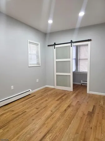 a view of an empty room with a closet