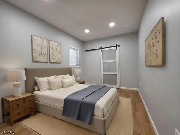 a bedroom with a bed and a walk in closet