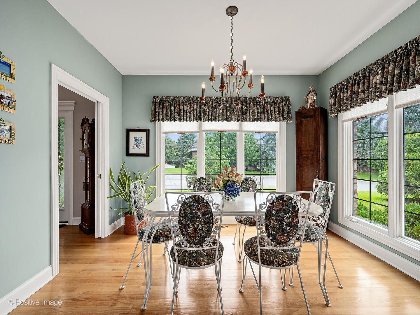 802 Kenmare Drive Burr Ridge, IL 60527 - Photo 12 of 43 a view of a dining room with furniture window and wooden floor
