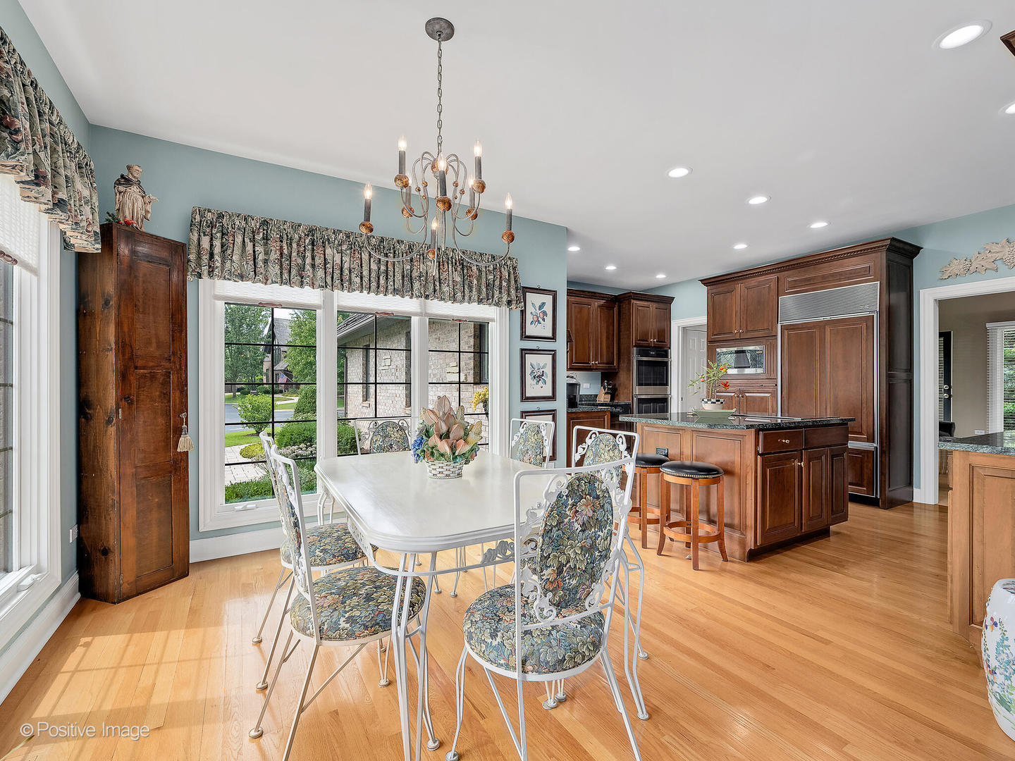 802 Kenmare Drive Burr Ridge, IL 60527 - Photo 13 of 43 a view of a dining room with furniture window and wooden floor