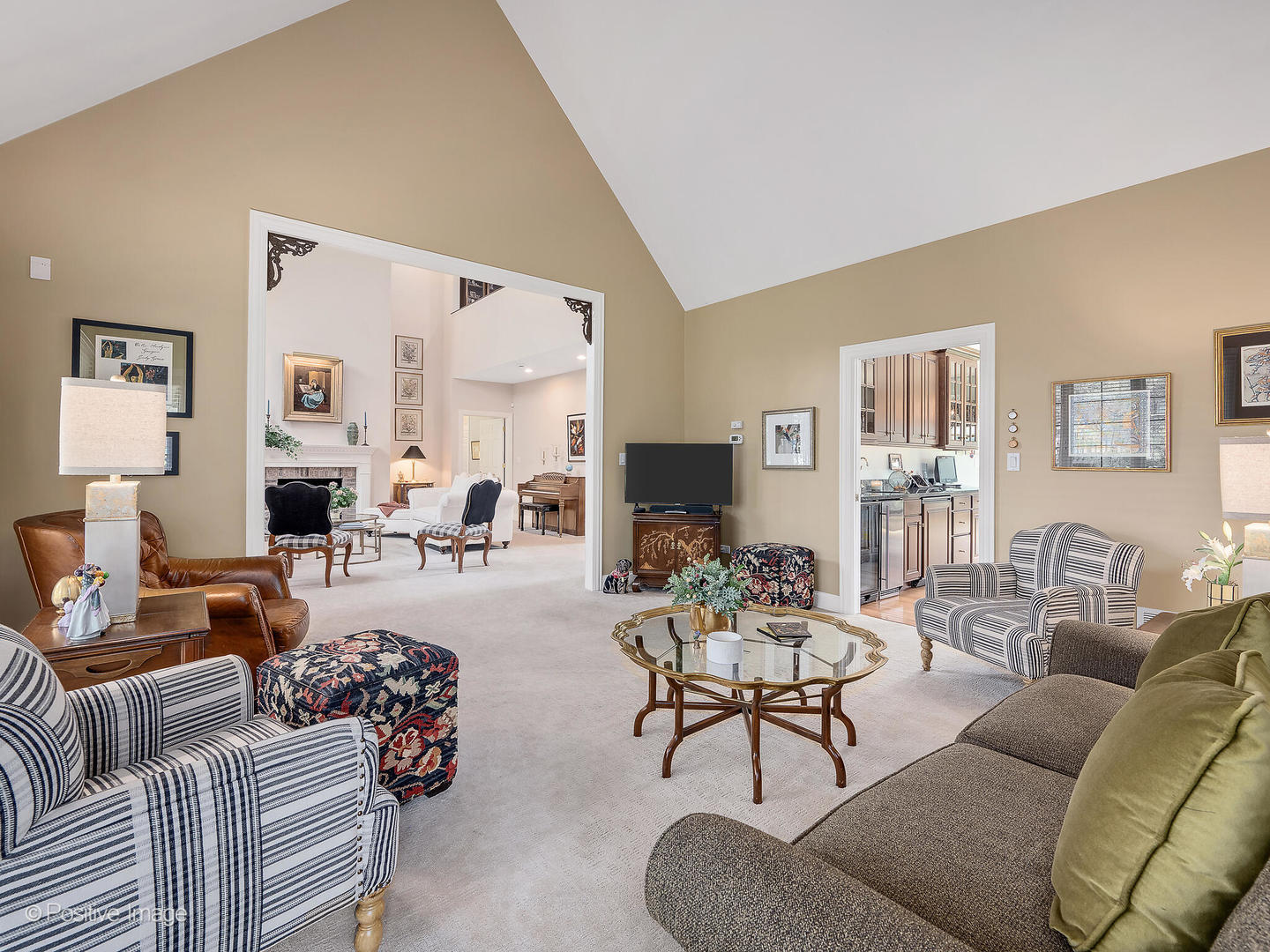 802 Kenmare Drive Burr Ridge, IL 60527 - Photo 22 of 43 a living room with furniture fireplace and a large mirror