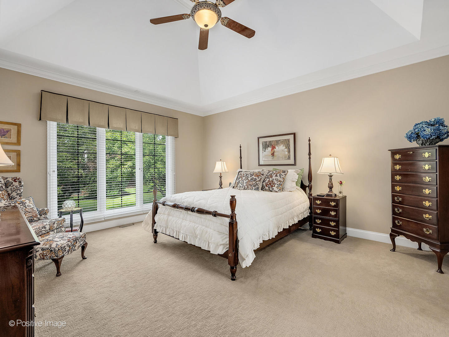 802 Kenmare Drive Burr Ridge, IL 60527 - Photo 25 of 43 a spacious bedroom with a bed and a chandelier