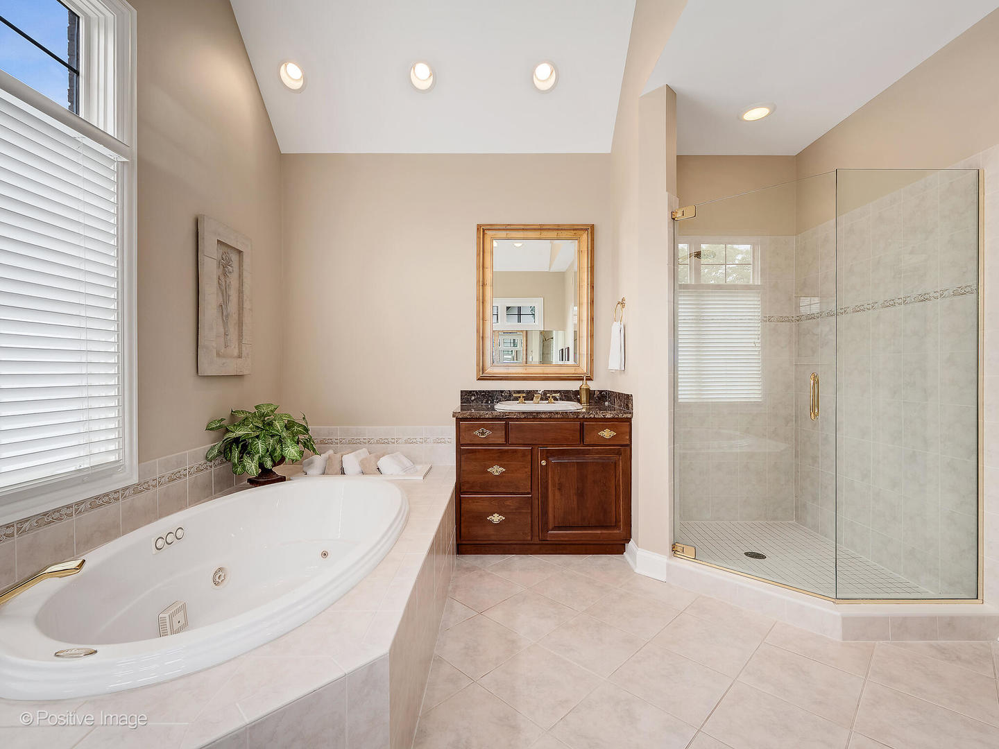 802 Kenmare Drive Burr Ridge, IL 60527 - Photo 28 of 43 a bathroom with a bathtub shower and a sink