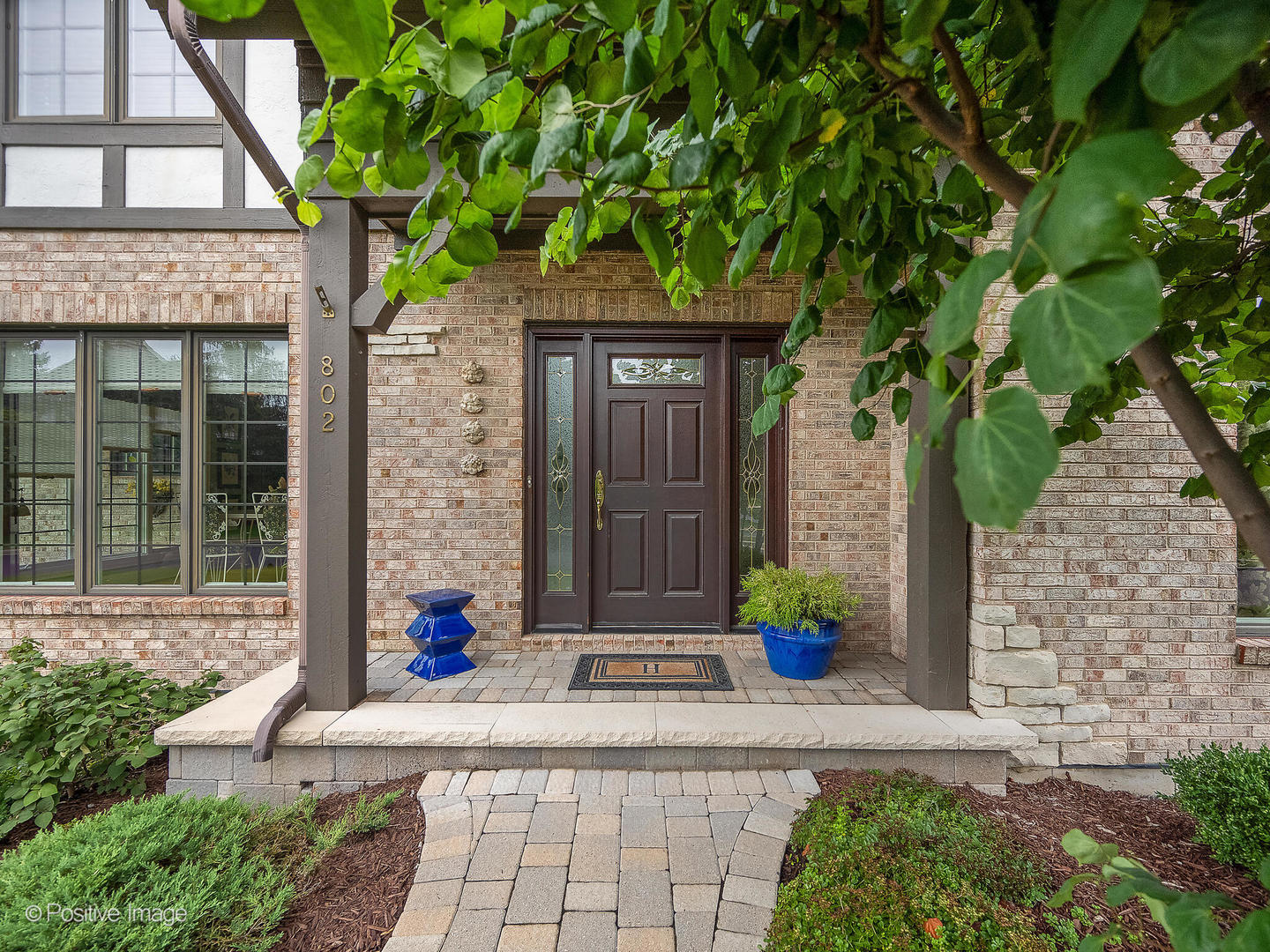 802 Kenmare Drive Burr Ridge, IL 60527 - Photo 3 of 43 a front view of a house with large trees