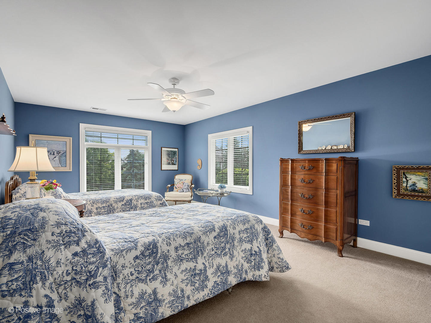 802 Kenmare Drive Burr Ridge, IL 60527 - Photo 32 of 43 a spacious bedroom with a bed and a chandelier