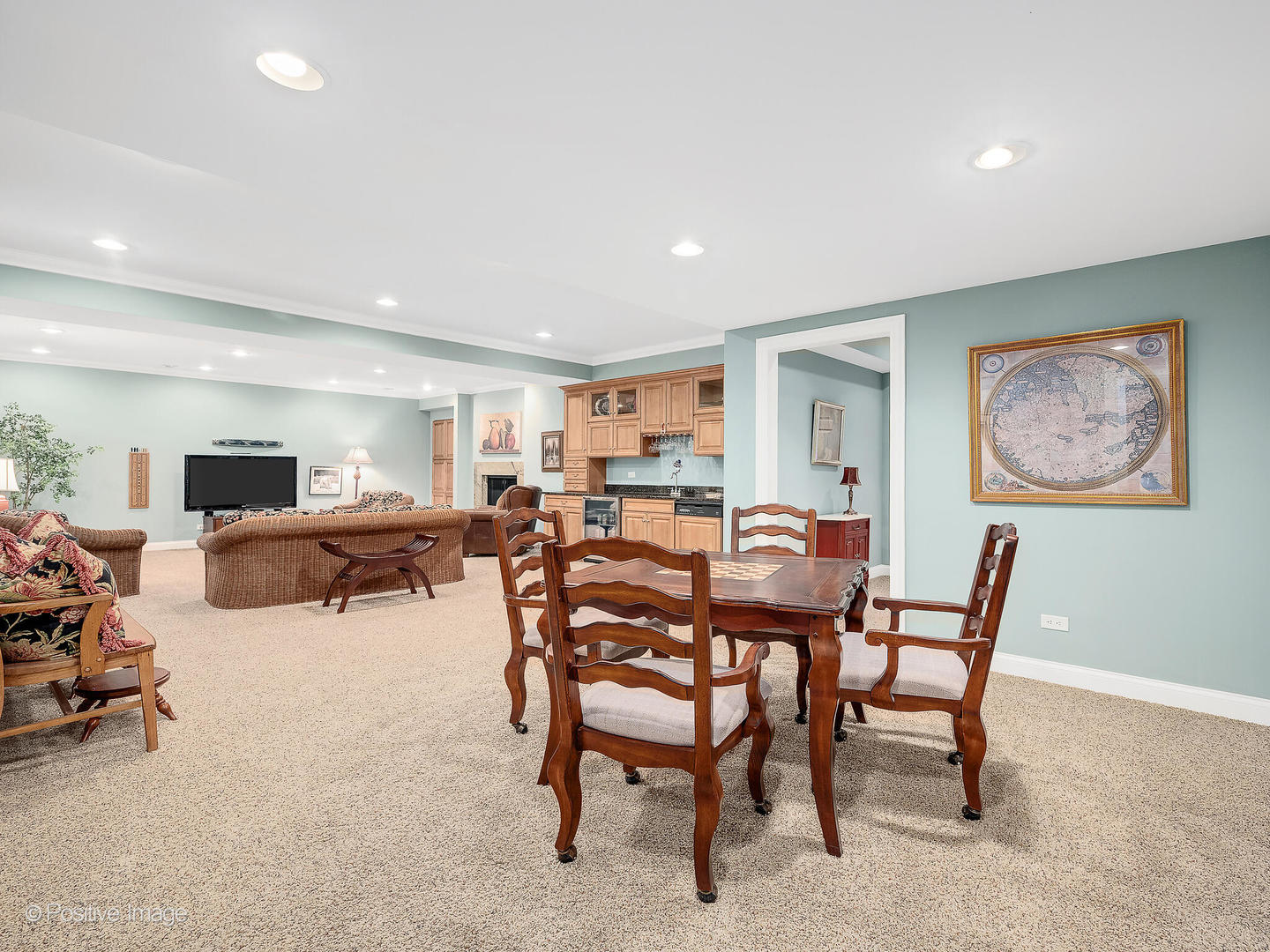 802 Kenmare Drive Burr Ridge, IL 60527 - Photo 33 of 43 a living room with furniture a table and a flat screen tv