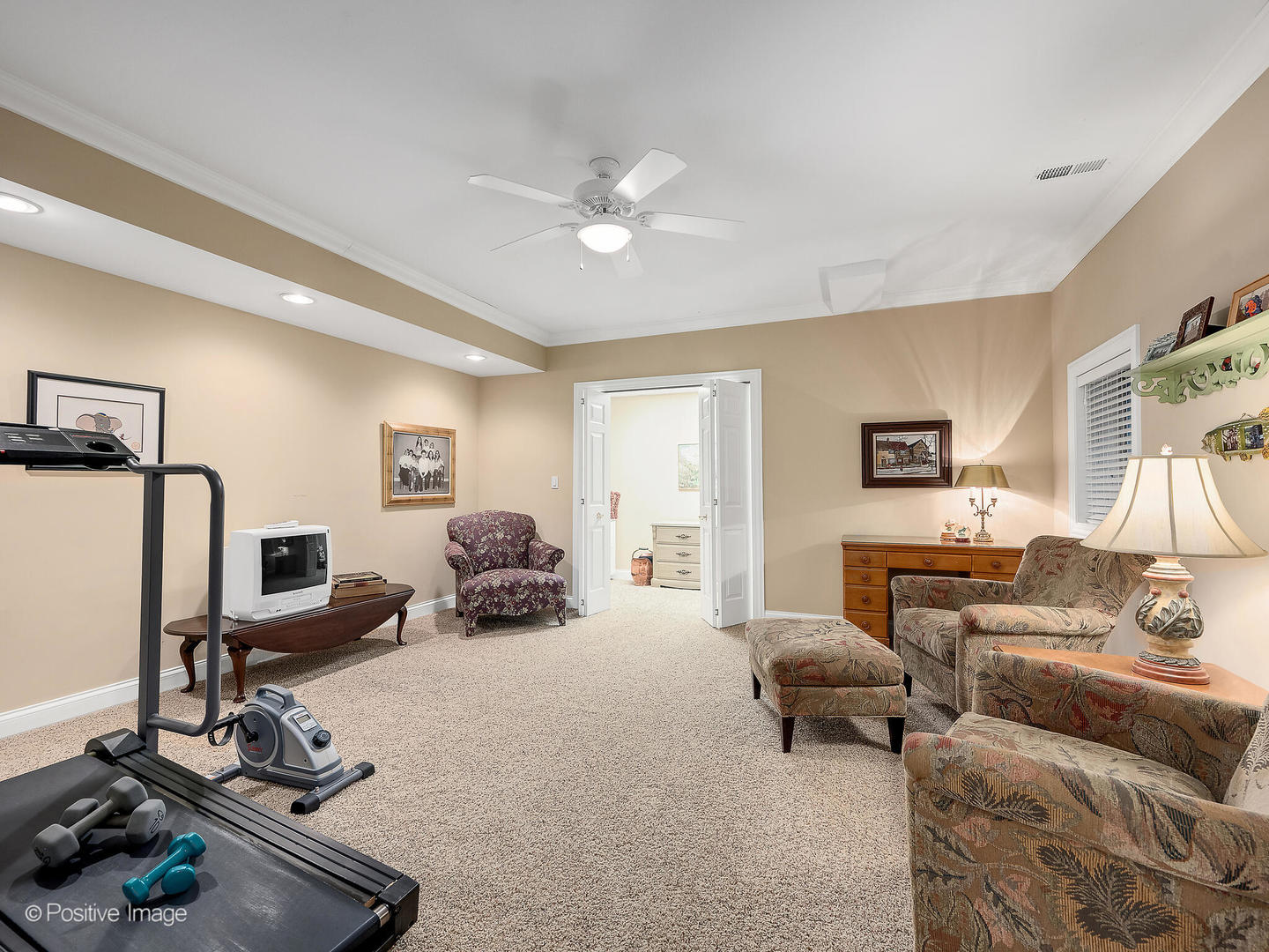 802 Kenmare Drive Burr Ridge, IL 60527 - Photo 36 of 43 a living room with furniture and a flat screen tv