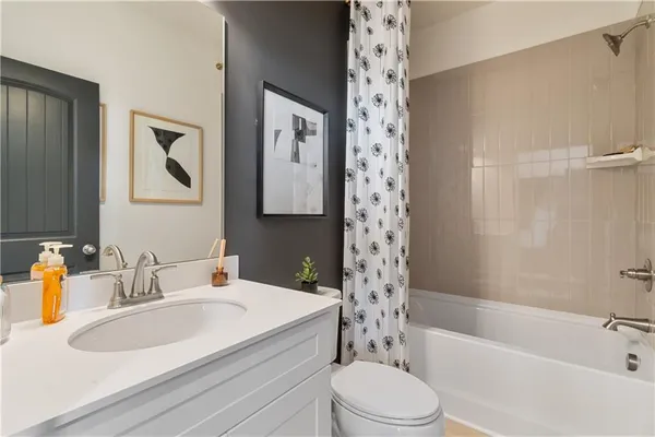a bathroom with a sink a toilet and a bathtub
