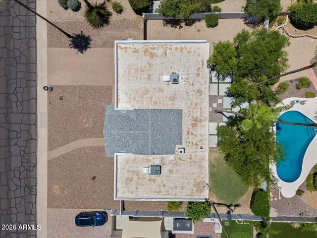 an aerial view of residential houses with outdoor space