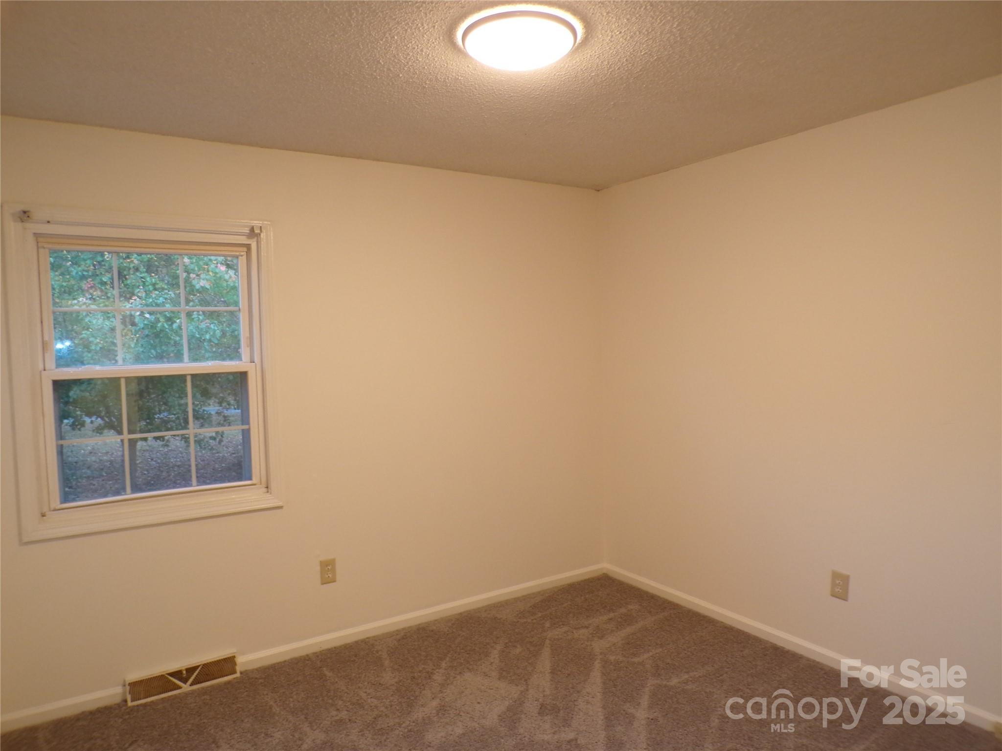 5391 Sapp Road Kannapolis, NC 28083 - Photo 11 of 15 an empty room with a window