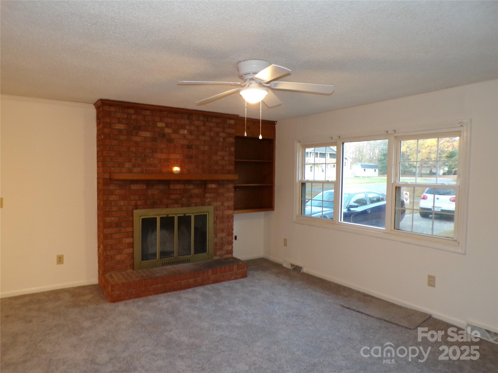 5391 Sapp Road Kannapolis, NC 28083 - Photo 3 of 15 a view of empty room with window and fireplace