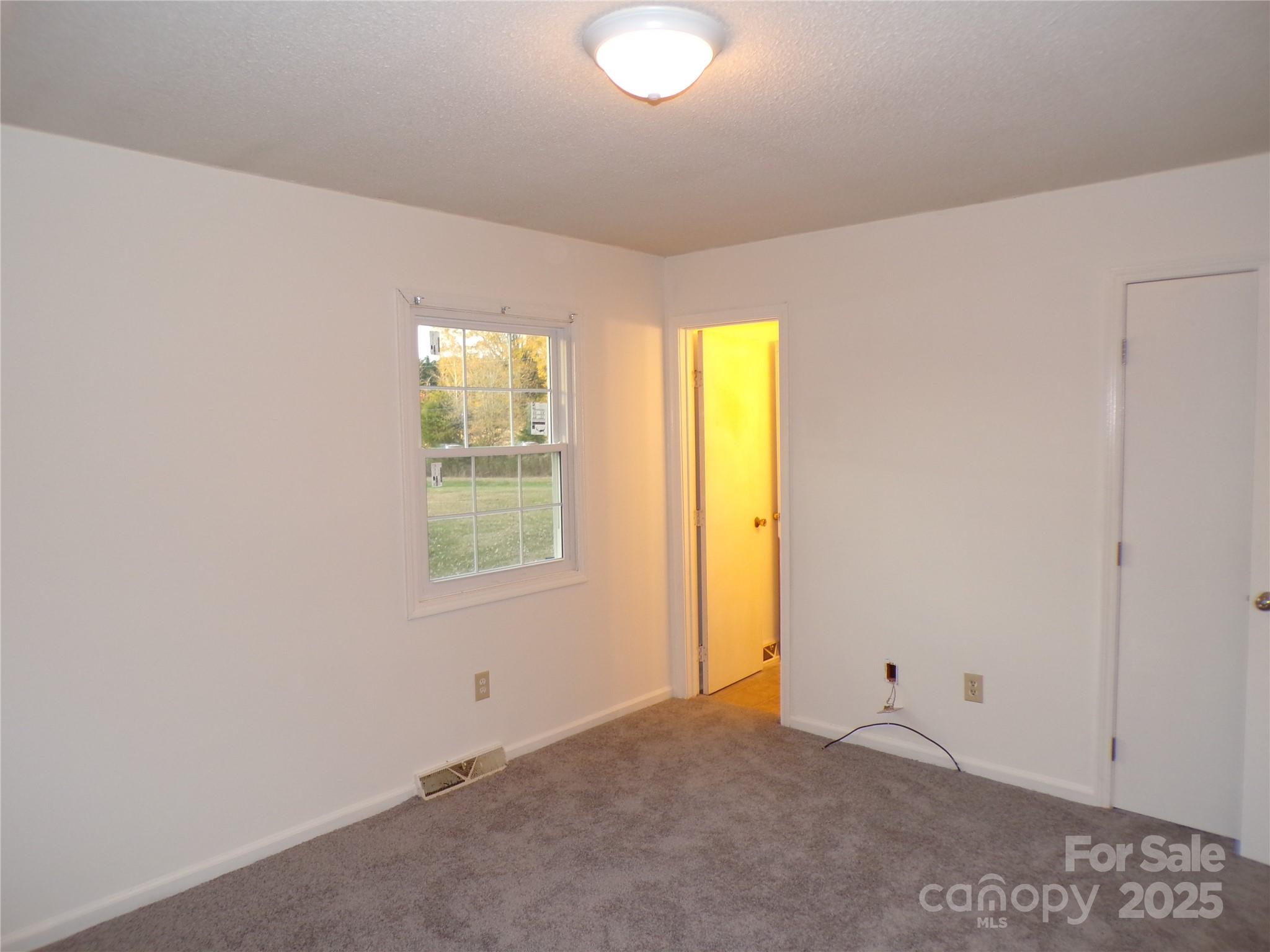 5391 Sapp Road Kannapolis, NC 28083 - Photo 8 of 15 a view of an empty room with a window