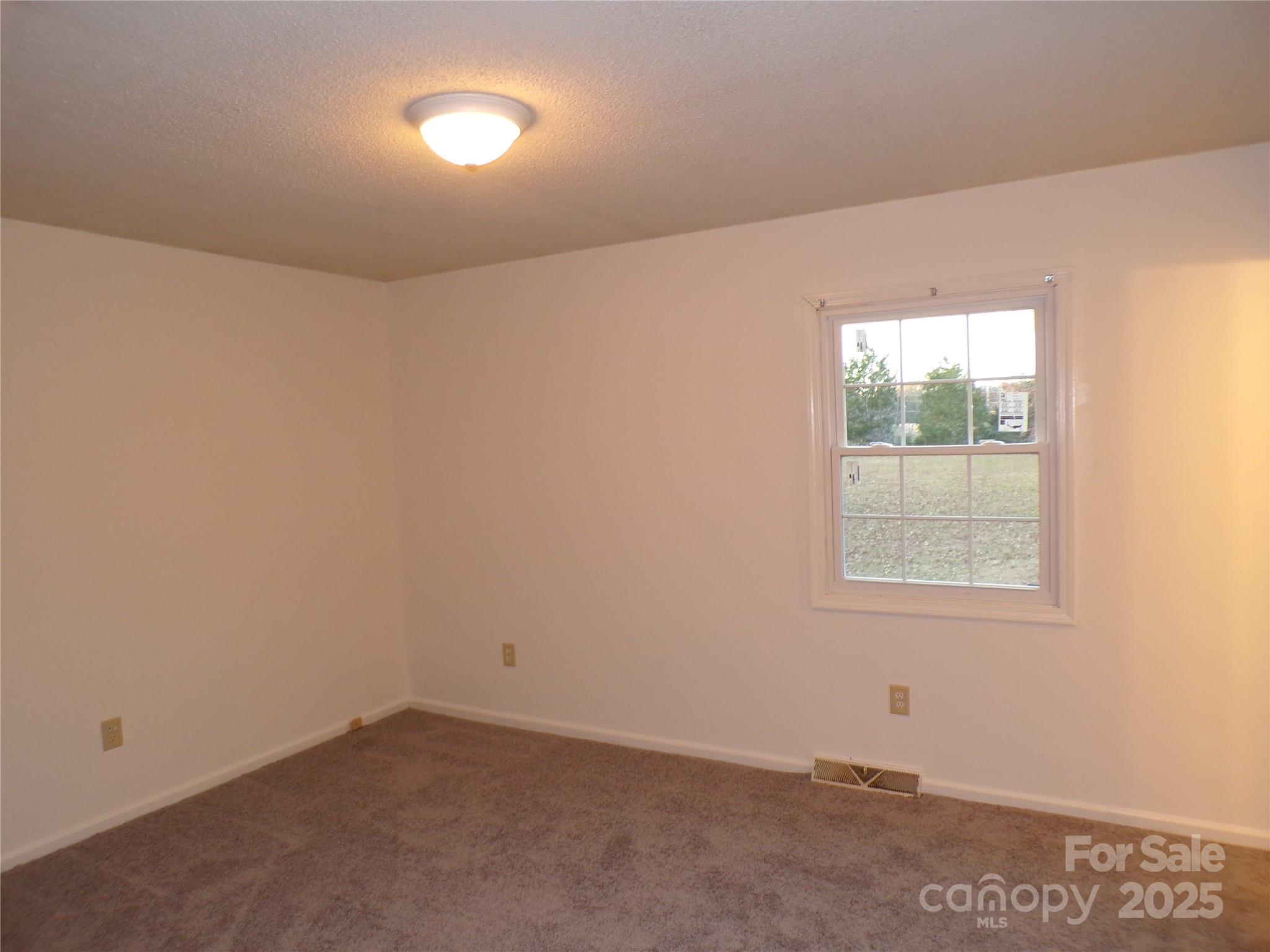 5391 Sapp Road Kannapolis, NC 28083 - Photo 9 of 15 an empty room with a window