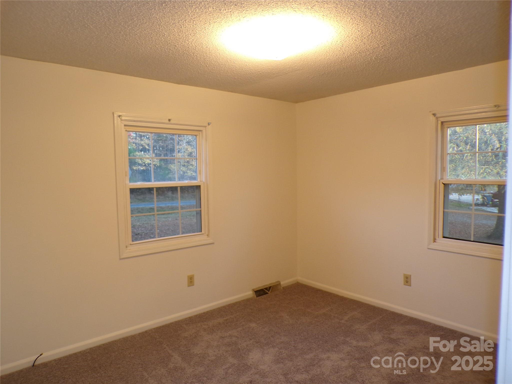 5391 Sapp Road Kannapolis, NC 28083 - Photo 10 of 15 an empty room with windows