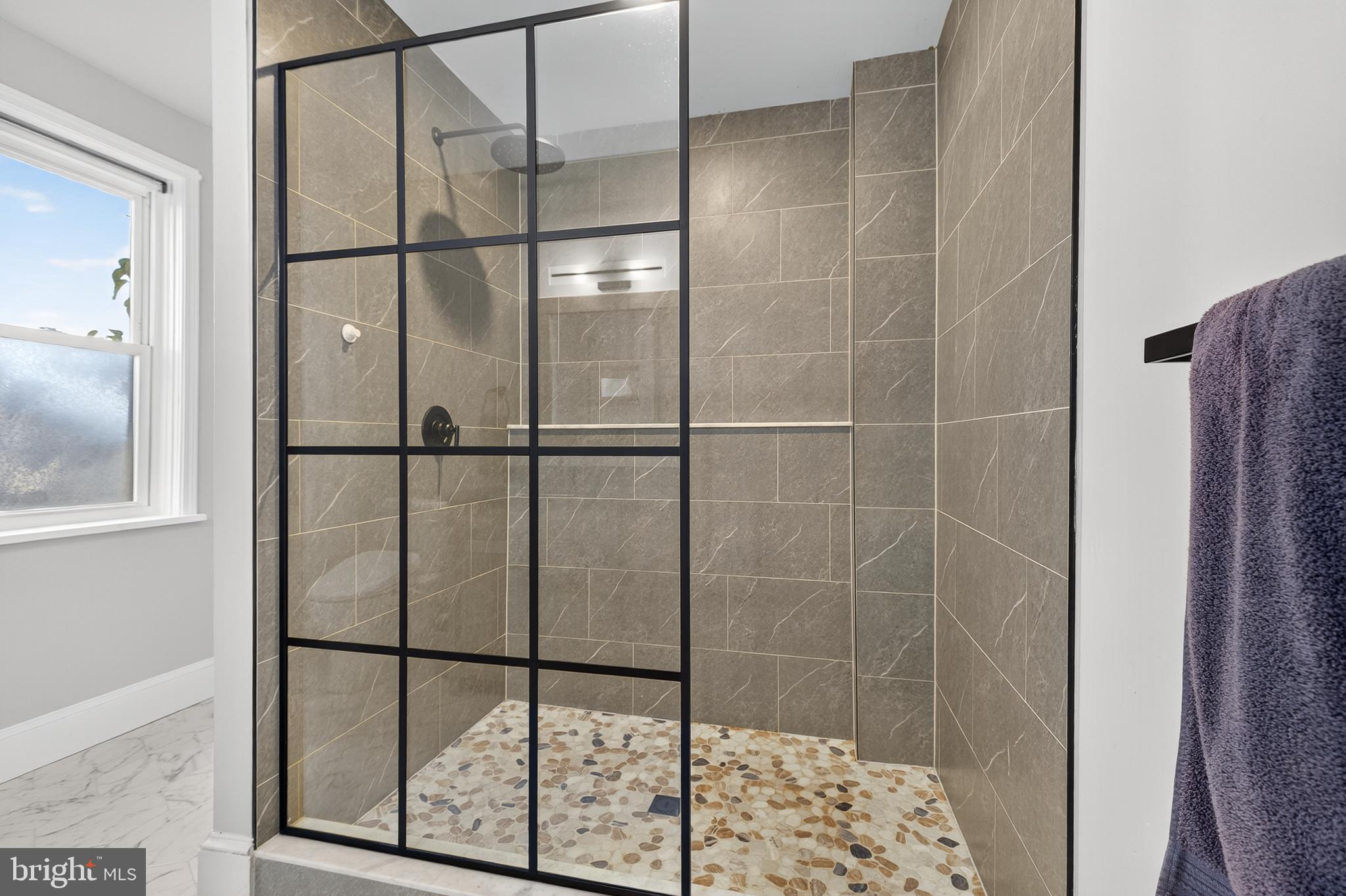 624 St Joseph Street Lancaster, PA 17603 - Photo 27 of 44 a bathroom with a glass shower door