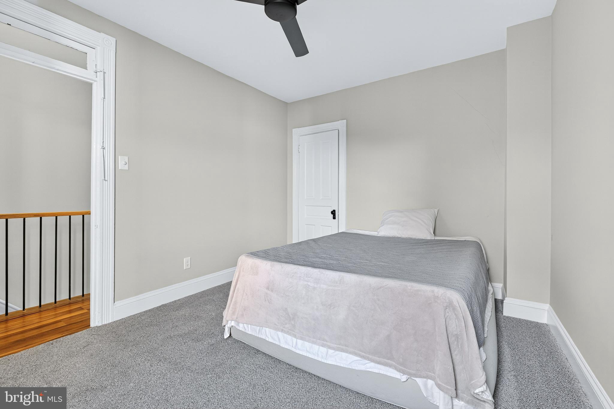 624 St Joseph Street Lancaster, PA 17603 - Photo 31 of 44 a spacious bedroom with a bed and a table