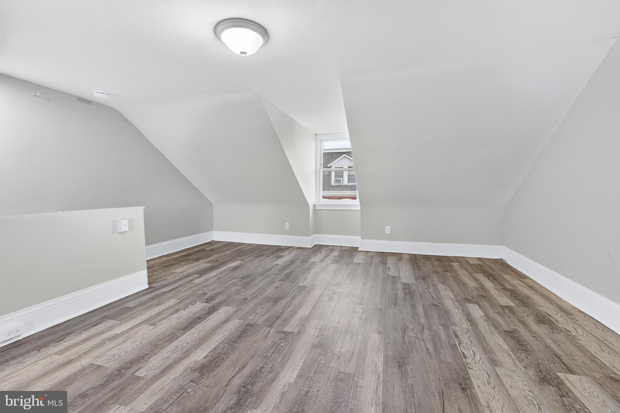 624 St Joseph Street Lancaster, PA 17603 - Photo 35 of 44 an empty room with wooden floor and windows