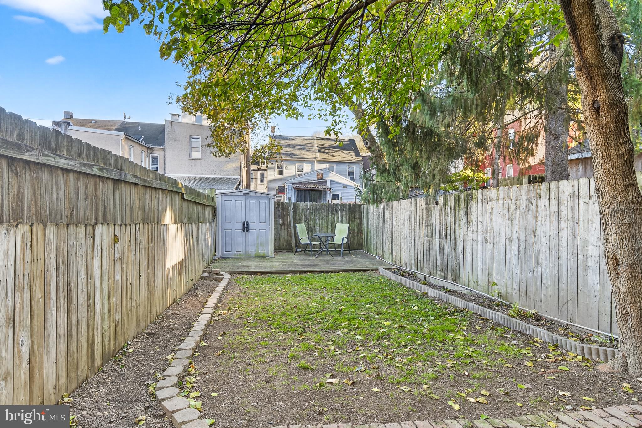 624 St Joseph Street Lancaster, PA 17603 - Photo 39 of 44 a view of a yard with wooden fence and a large tree