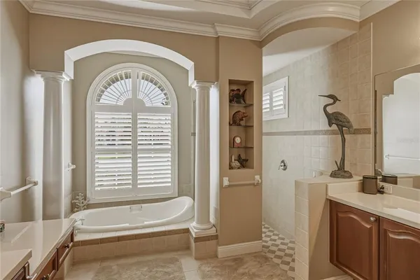 a view of a building with a bench and potted plants