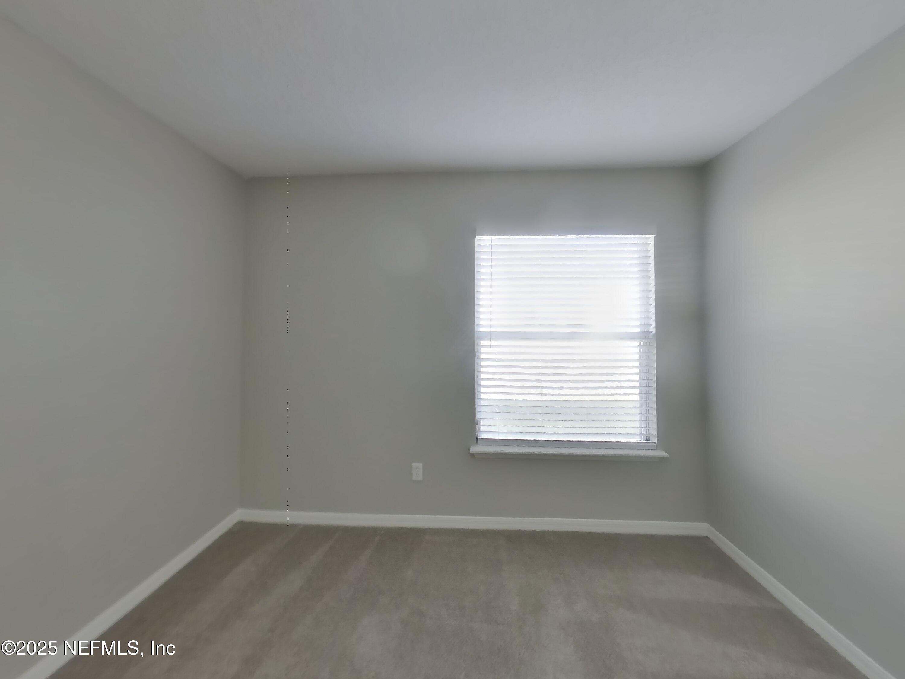 984 Fox Chapel Lane Jacksonville, FL 32221 - Photo 11 of 15 an empty room with a window