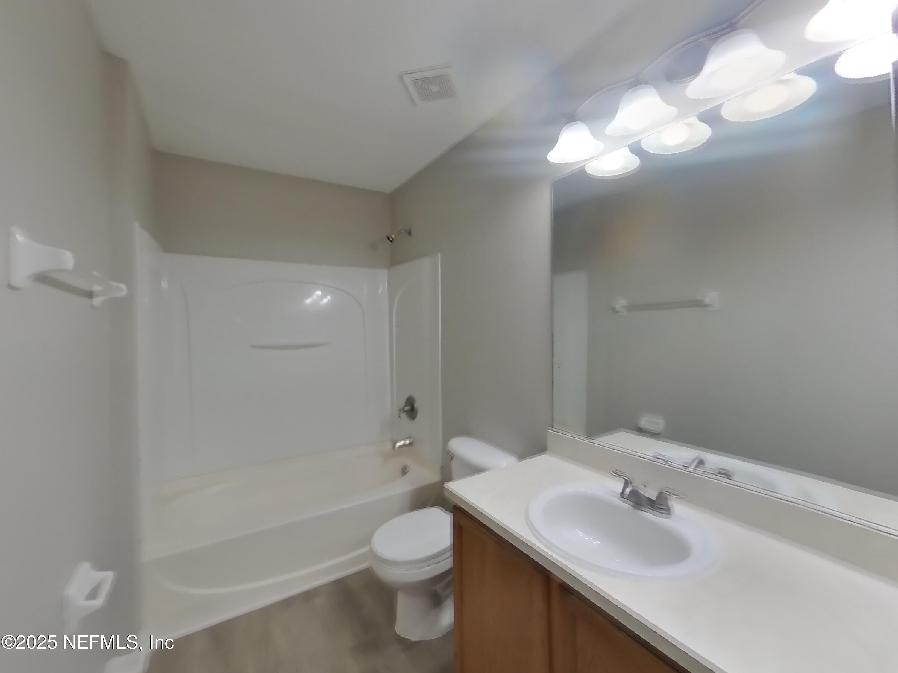 984 Fox Chapel Lane Jacksonville, FL 32221 - Photo 12 of 15 a bathroom with a sink a toilet and shower