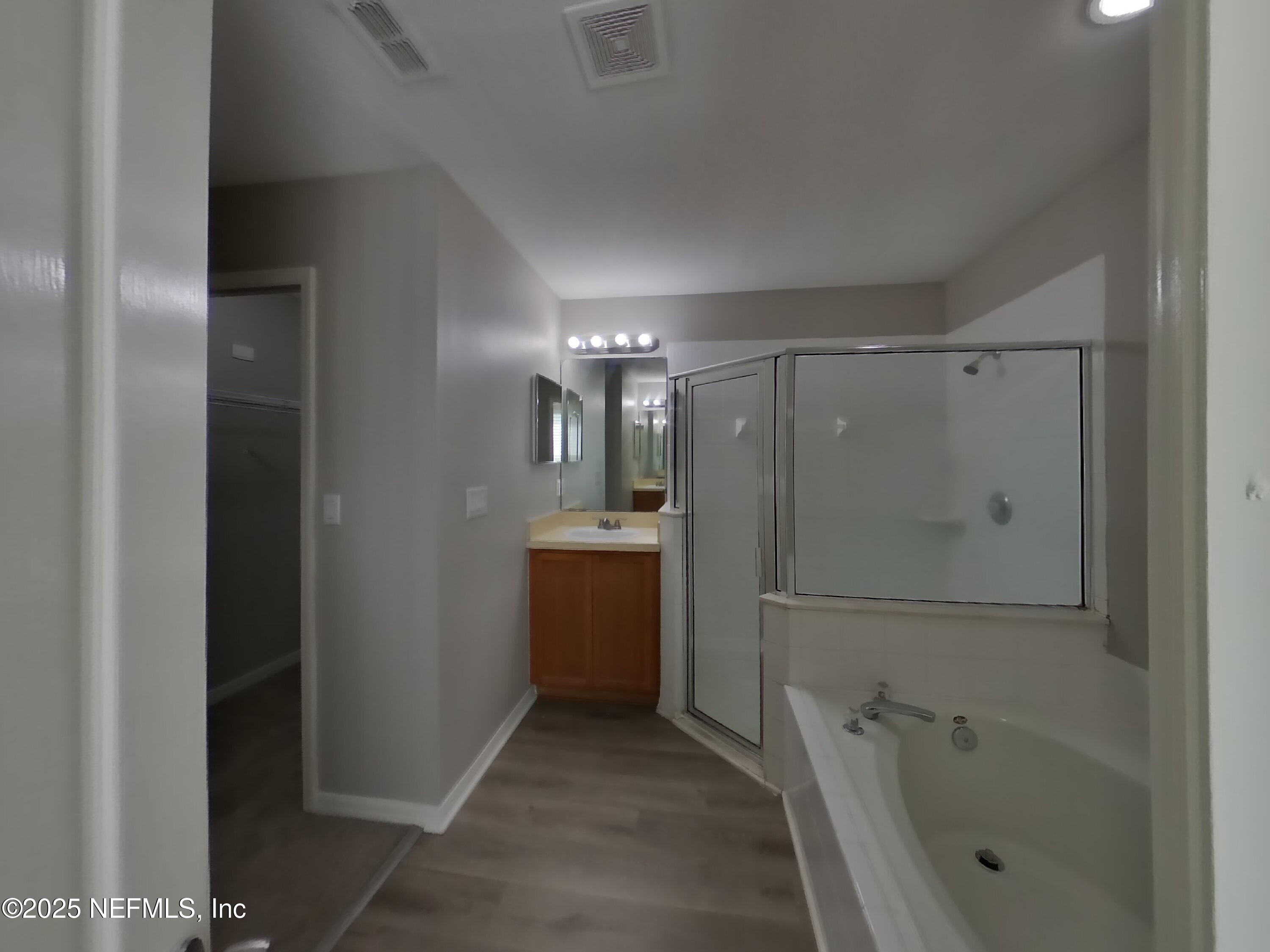 984 Fox Chapel Lane Jacksonville, FL 32221 - Photo 7 of 15 a bathroom with a shower a sink and a mirror