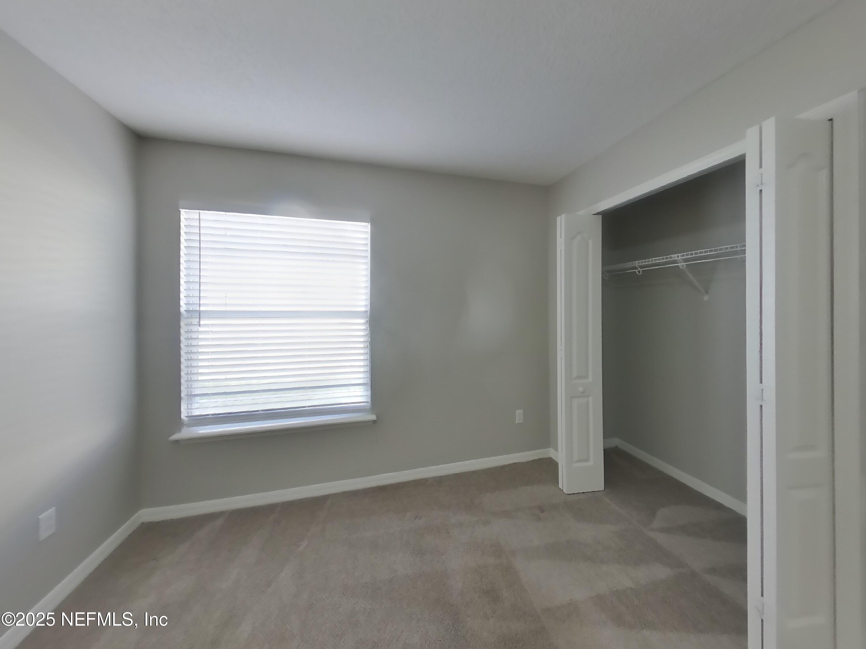 984 Fox Chapel Lane Jacksonville, FL 32221 - Photo 10 of 15 a view of an empty room with a window