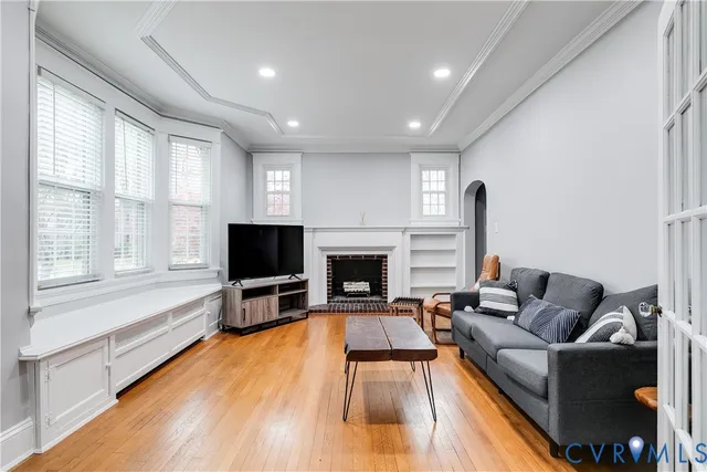 a living room with furniture and a fireplace