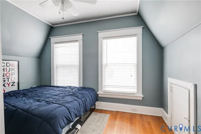 a spacious bedroom with a large bed and a window