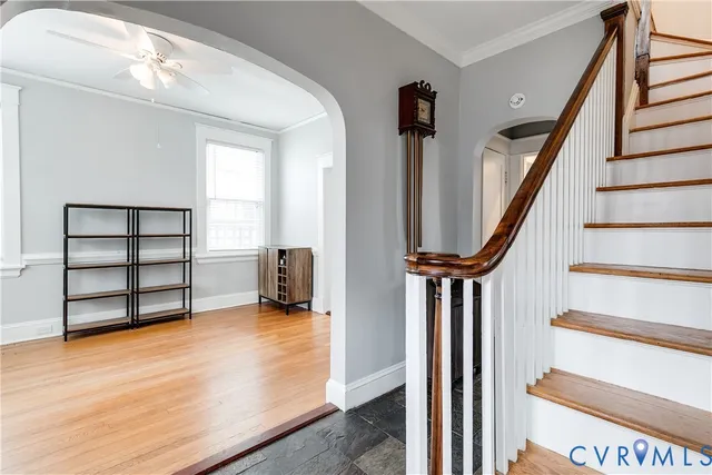 a view of a livingroom with wooden floor and furniture