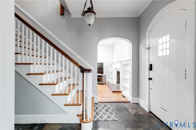 a view of entryway and hall with wooden floor