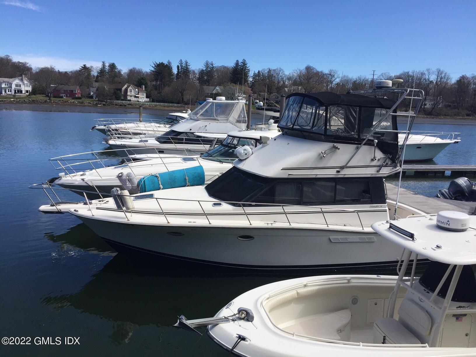 7 River Road, Unit BOAT SLIP E12 Cos Cob, CT 06807 - Photo 1 of 3 a terrace of a house with outdoor seating