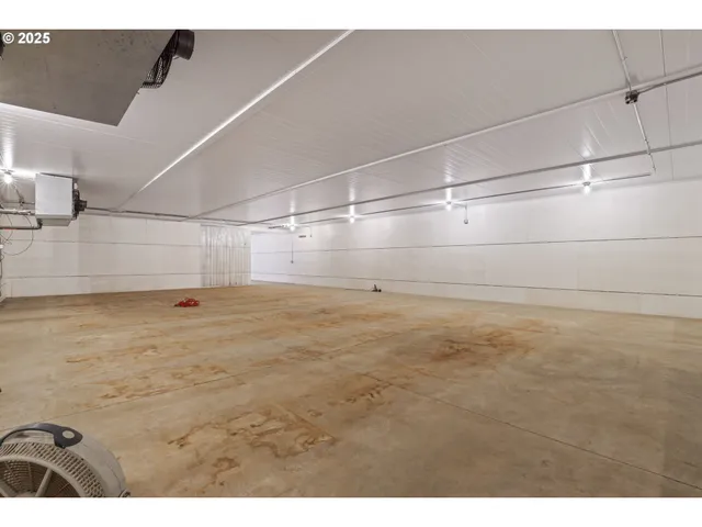 a roof deck with table and chairs