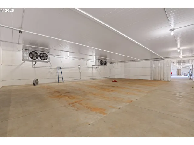 a view of an house with backyard space and balcony