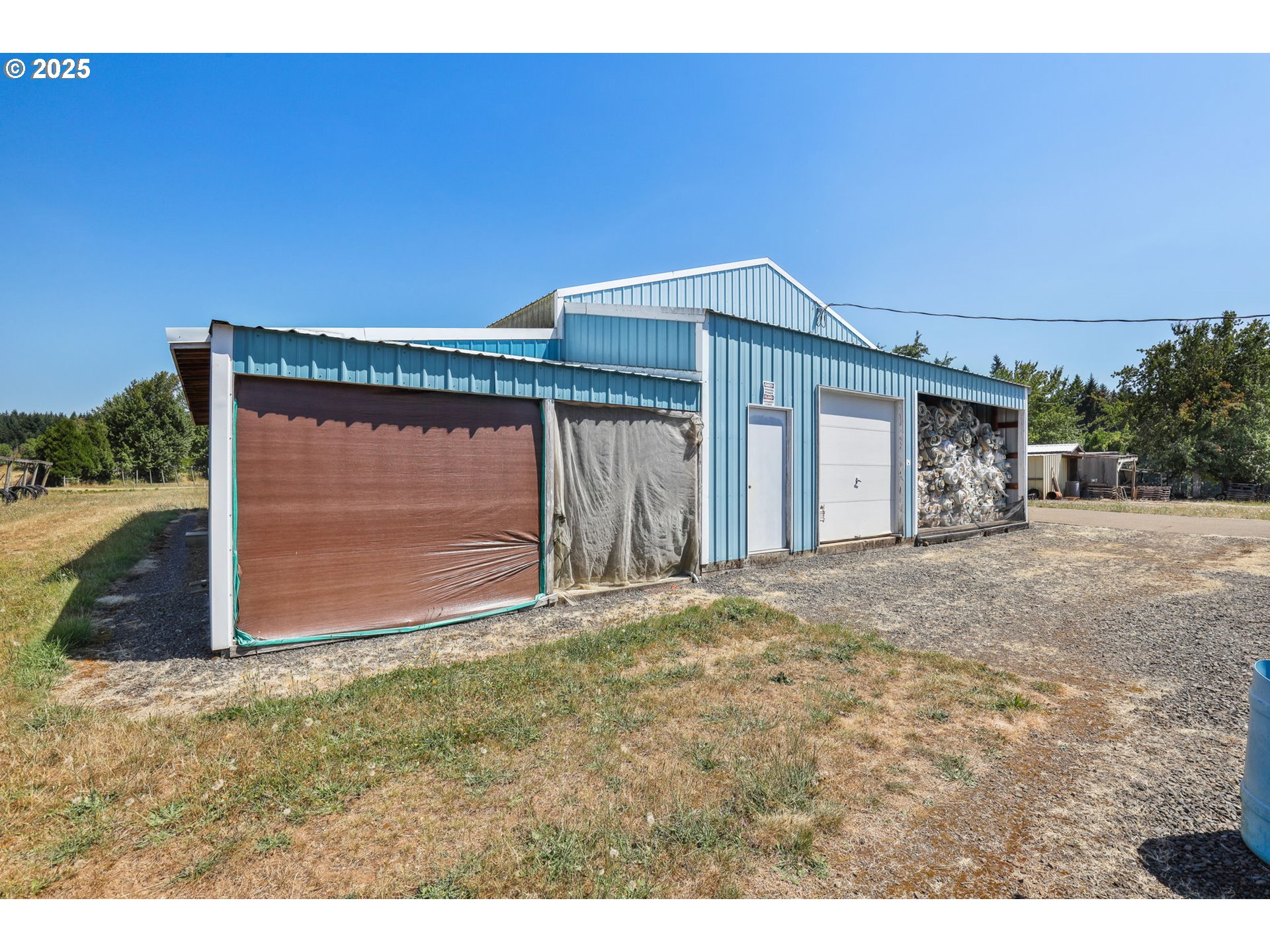 31909 Highway 211 Eagle Creek, OR 97022 - Photo 46 of 48 a front view of a house with a yard and garage