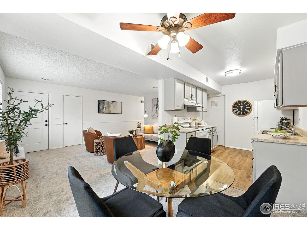9857 Lane Street Thornton, CO 80260 - Photo 12 of 38 a view of a dining room with furniture and a chandelier