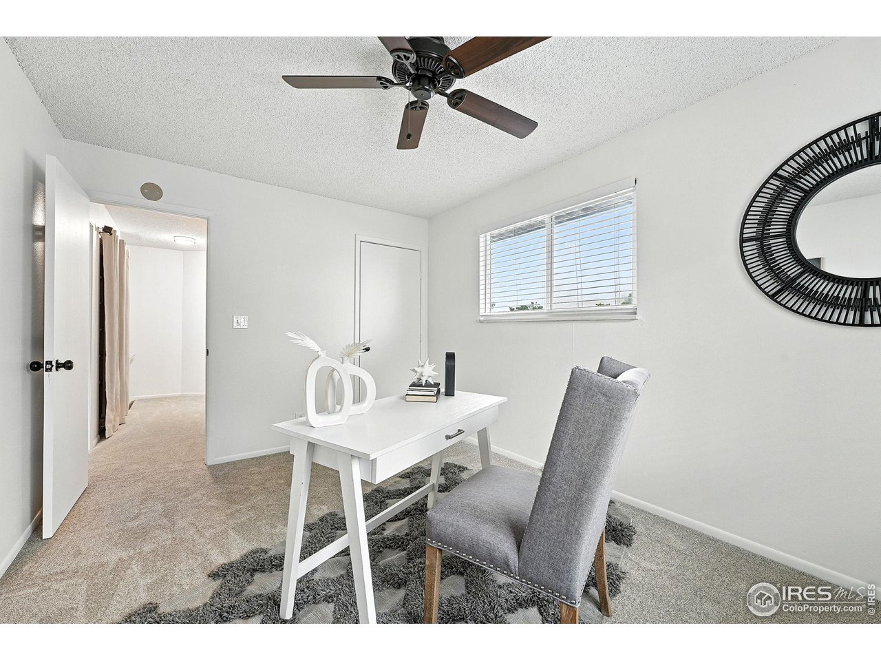 9857 Lane Street Thornton, CO 80260 - Photo 25 of 38 a dining room with furniture and chandelier fan