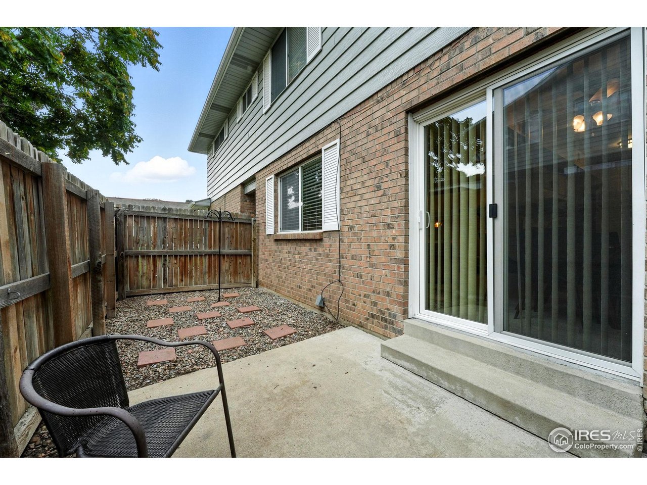 9857 Lane Street Thornton, CO 80260 - Photo 29 of 38 a backyard of a house with yard fire pit and outdoor seating